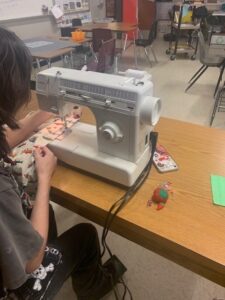 Student working on a Sewing Project from a Mini-grant